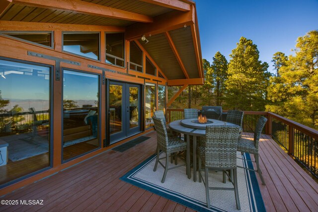 deck featuring french doors and outdoor dining space