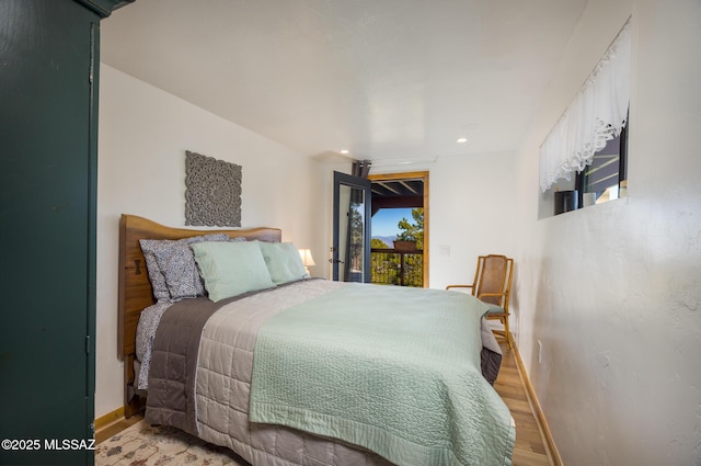 bedroom featuring baseboards, recessed lighting, light wood-style flooring, and access to exterior
