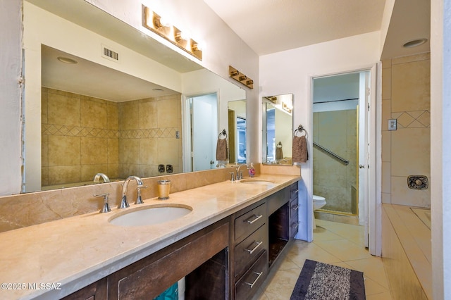1310 N Dorado Way, Tucson, AZ 85715 - full bath with tile patterned floors, a stall shower, double vanity, and toilet