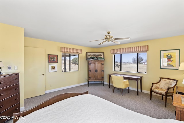 carpeted bedroom featuring ceiling fan and baseboards