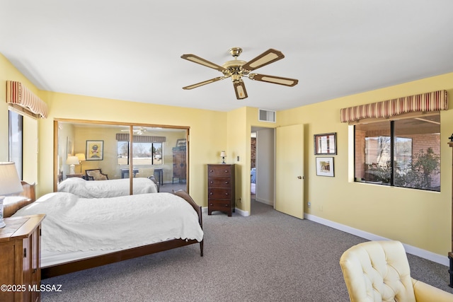 bedroom featuring ceiling fan, carpet flooring, visible vents, and baseboards