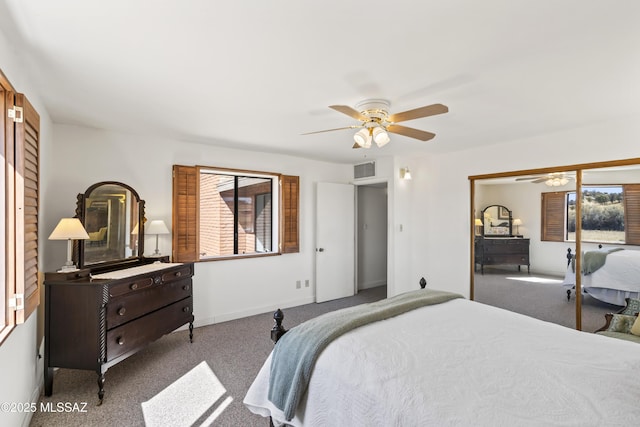 carpeted bedroom featuring ceiling fan, visible vents, and baseboards