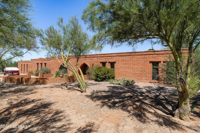 view of front of house featuring brick siding