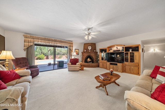 living room featuring light carpet, a brick fireplace, and a ceiling fan