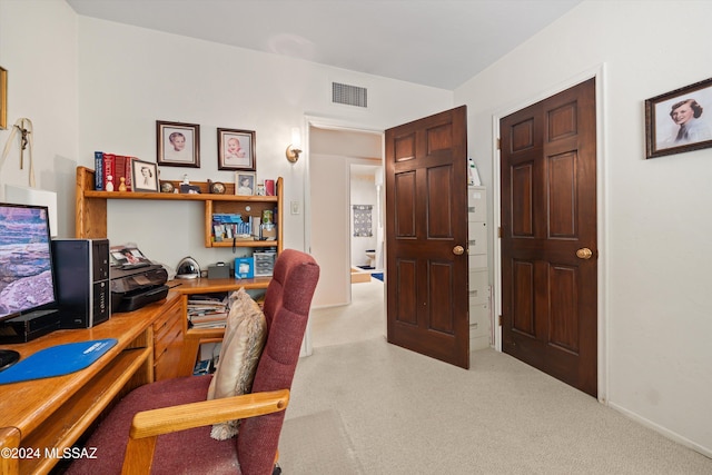 office area with visible vents and light colored carpet