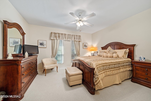 bedroom with light carpet and ceiling fan