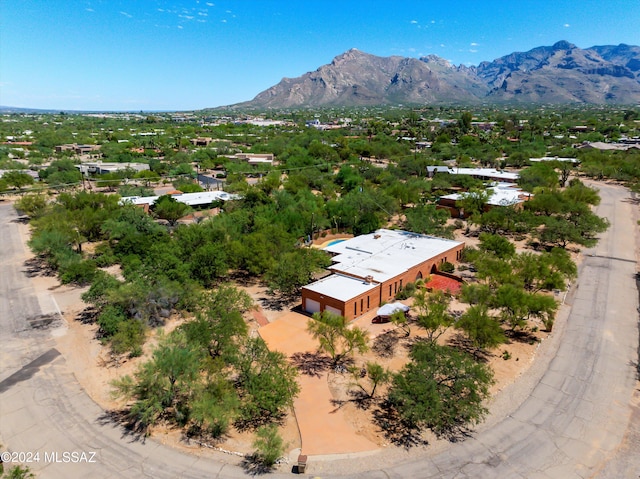 birds eye view of property with a mountain view