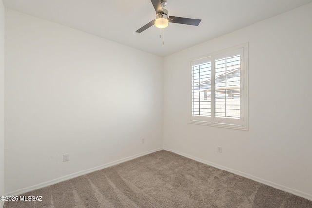 empty room featuring carpet, baseboards, and ceiling fan