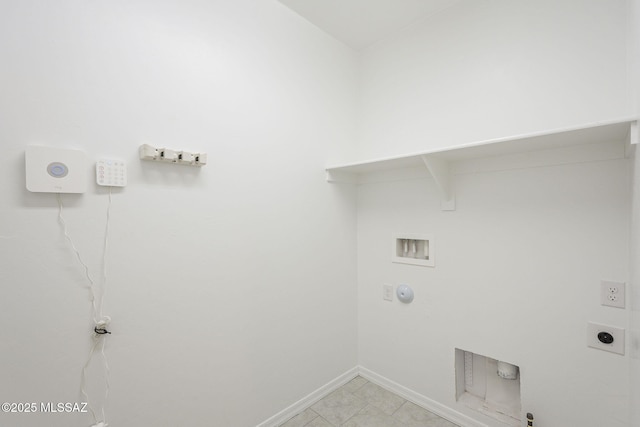 clothes washing area featuring laundry area, baseboards, gas dryer hookup, washer hookup, and electric dryer hookup