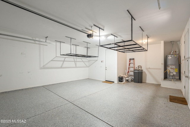 garage featuring water heater and a garage door opener