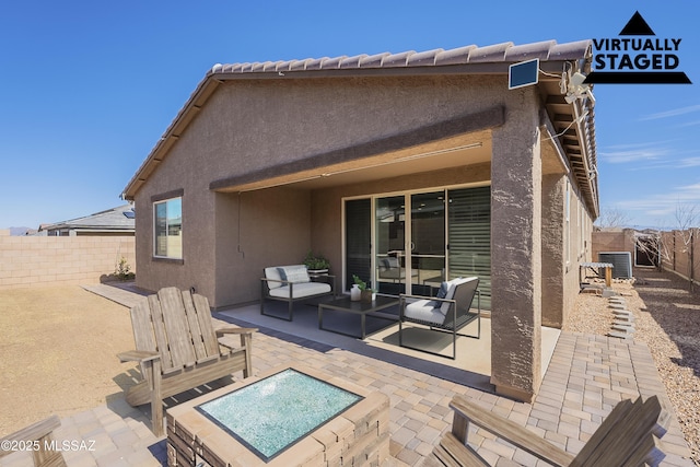 back of property featuring central air condition unit, a patio area, a fenced backyard, and stucco siding