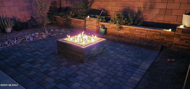 view of patio / terrace featuring a fire pit