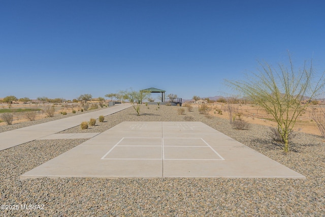 exterior space with community basketball court and a gazebo