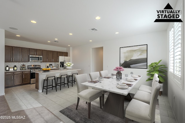 dining room featuring recessed lighting, visible vents, and light tile patterned floors