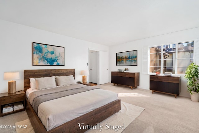 bedroom featuring light carpet