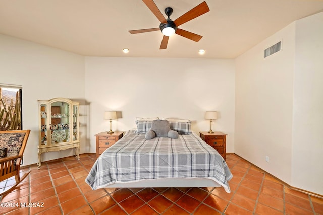 tiled bedroom with ceiling fan and visible vents