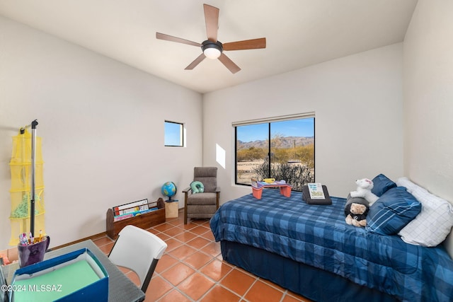 bedroom with tile patterned flooring and a ceiling fan