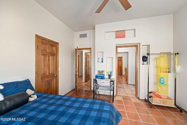 tiled bedroom featuring ceiling fan and visible vents