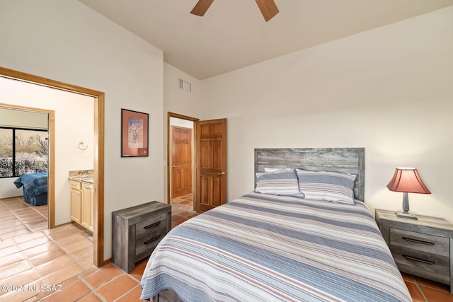 bedroom with ceiling fan, light tile patterned flooring, connected bathroom, and visible vents