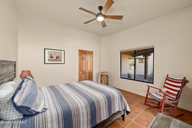 bedroom with tile patterned flooring and a ceiling fan