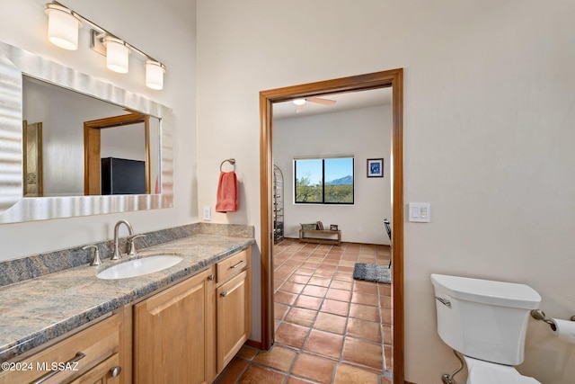 bathroom with vanity, toilet, and tile patterned floors