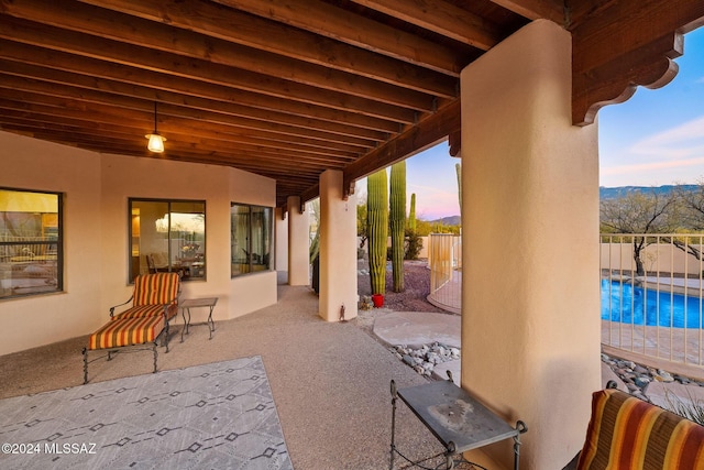 view of patio featuring fence and a fenced in pool