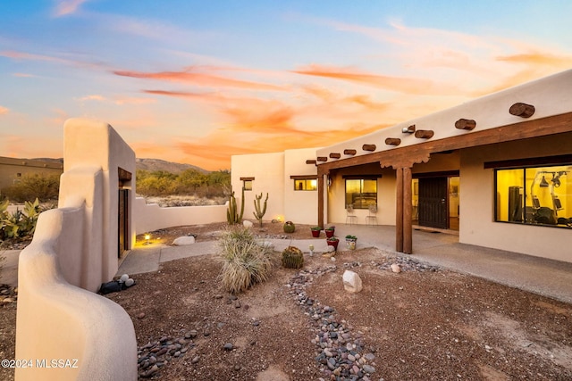 exterior space featuring a patio area and fence