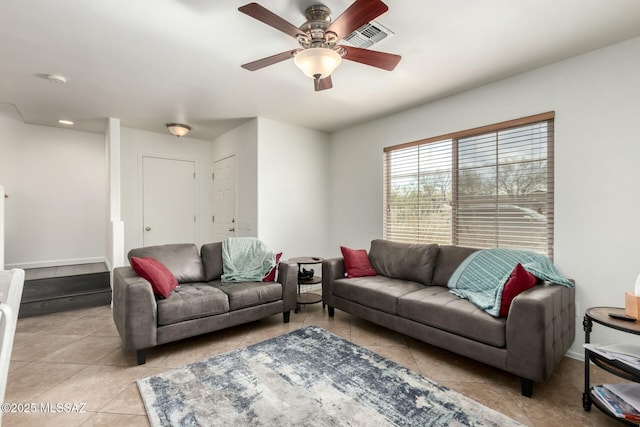 living room with visible vents, ceiling fan, baseboards, and light tile patterned floors