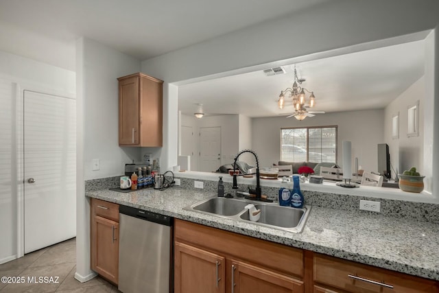 kitchen featuring light tile patterned floors, visible vents, stainless steel dishwasher, an inviting chandelier, and a sink