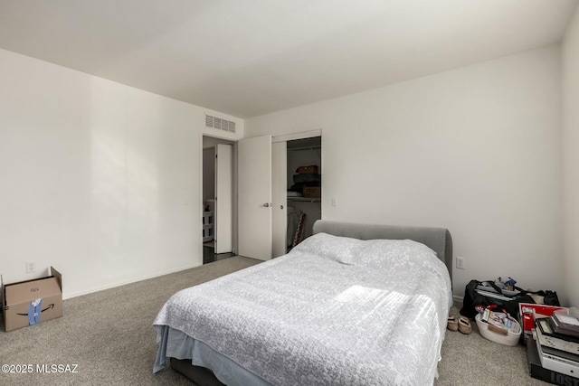 bedroom featuring a closet, visible vents, and carpet flooring