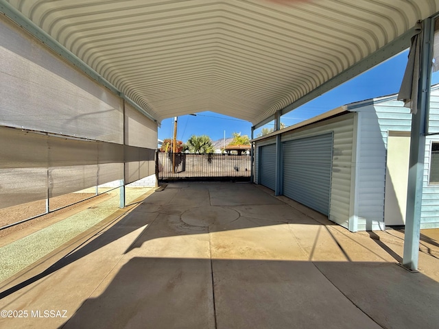 view of parking with fence