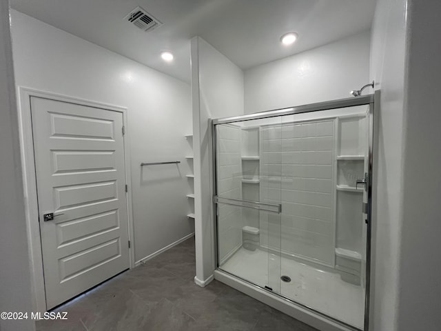 full bathroom with recessed lighting, visible vents, a shower stall, and baseboards