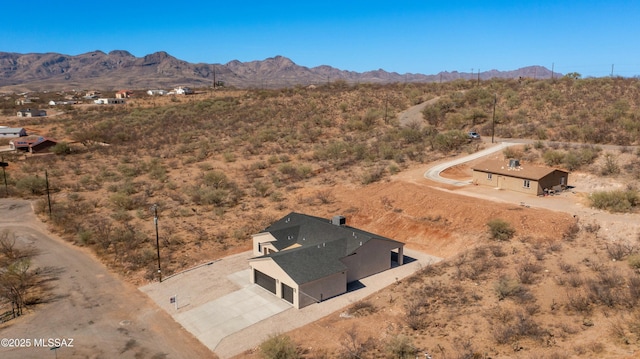 bird's eye view with a desert view and a mountain view