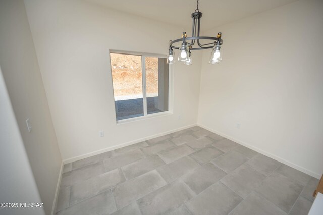 kitchen with dishwasher, a sink, decorative light fixtures, and light stone countertops