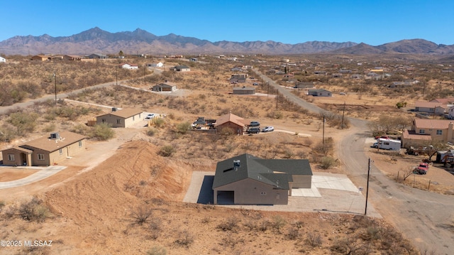 birds eye view of property featuring a mountain view