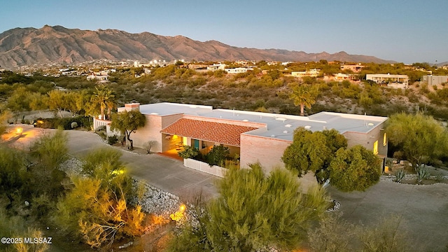 birds eye view of property with a mountain view