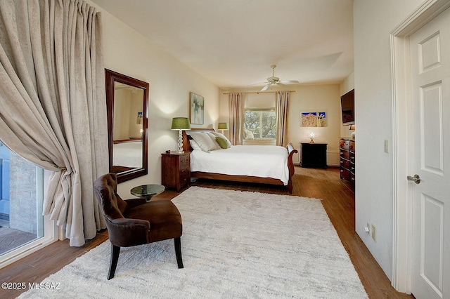 bedroom with ceiling fan and wood finished floors