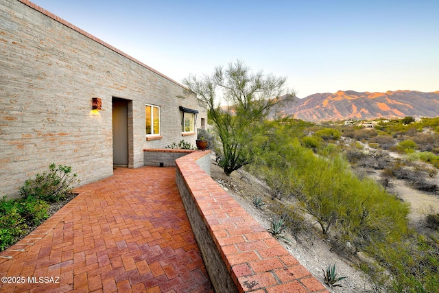 view of patio / terrace with a mountain view