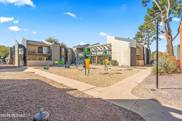 communal playground featuring a residential view