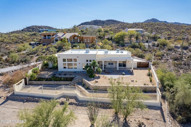 birds eye view of property with a mountain view