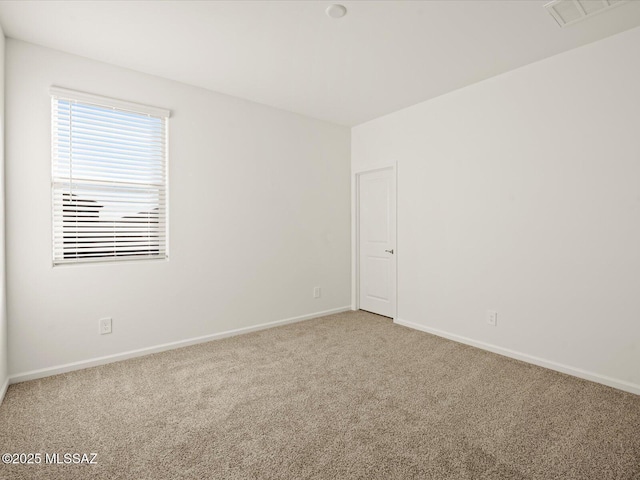 314 N Pecan Pie Pl, Sahuarita, AZ 85629 - spare room featuring baseboards, visible vents, and carpet flooring
