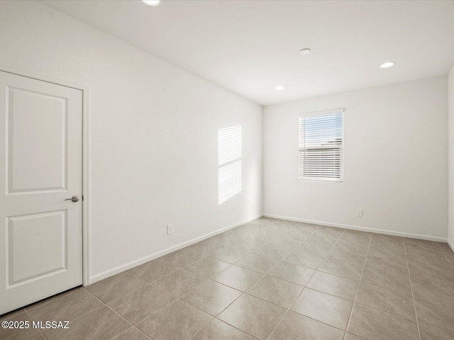 314 N Pecan Pie Pl, Sahuarita, AZ 85629 - unfurnished room with light tile patterned flooring, recessed lighting, and baseboards