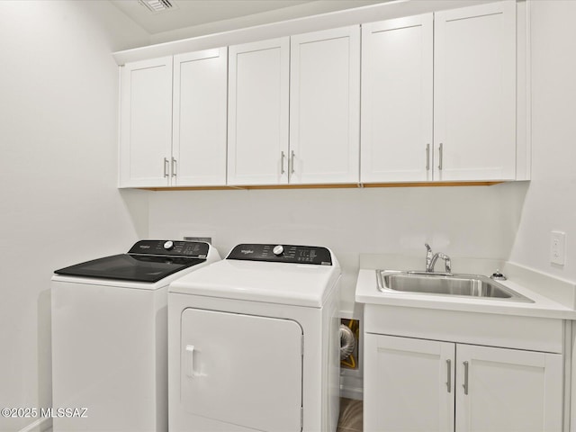314 N Pecan Pie Pl, Sahuarita, AZ 85629 - washroom featuring cabinet space, washing machine and clothes dryer, and a sink