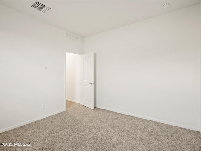314 N Pecan Pie Pl, Sahuarita, AZ 85629 - empty room featuring light colored carpet, visible vents, and baseboards