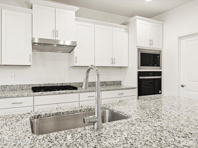 314 N Pecan Pie Pl, Sahuarita, AZ 85629 - kitchen with black appliances, a sink, white cabinetry, and under cabinet range hood