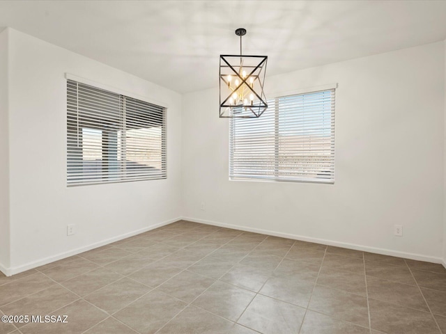 314 N Pecan Pie Pl, Sahuarita, AZ 85629 - empty room featuring a chandelier, baseboards, light tile patterned floors, and plenty of natural light