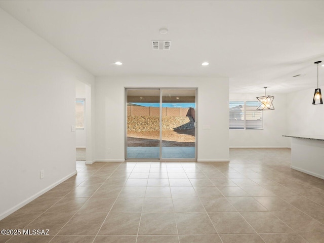 314 N Pecan Pie Pl, Sahuarita, AZ 85629 - unfurnished living room with baseboards, recessed lighting, light tile patterned floors, and visible vents