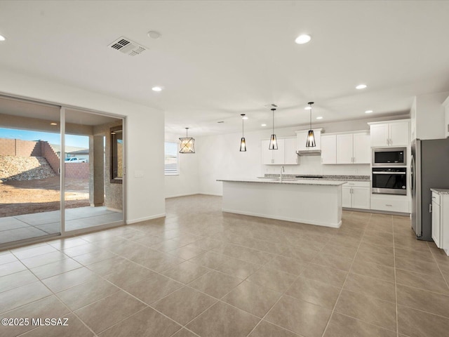 314 N Pecan Pie Pl, Sahuarita, AZ 85629 - kitchen with recessed lighting, stainless steel appliances, light tile patterned floors, visible vents, and wall chimney exhaust hood