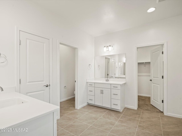 314 N Pecan Pie Pl, Sahuarita, AZ 85629 - bathroom featuring two vanities, tile patterned flooring, and a sink
