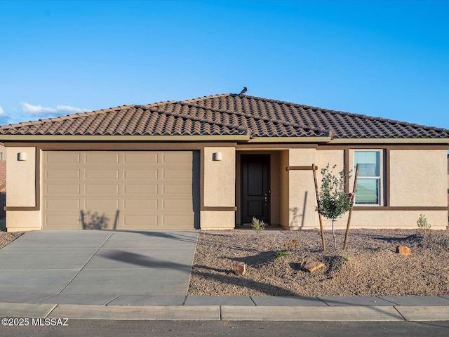 314 N Pecan Pie Pl, Sahuarita, AZ 85629 - ranch-style home featuring driveway, a tiled roof, stucco siding, and an attached garage
